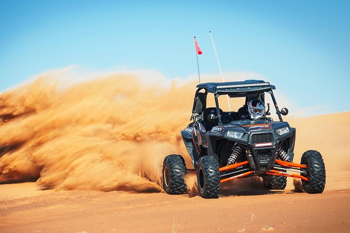 Experience the rush of dune bashing in Dubai’s breathtaking desert where you navigate sandy hills and enjoy refreshing snacks after an unforgettable ride. Adventure awaits!